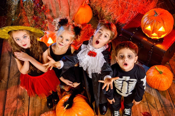 Kids All Dressed Up For A Halloween Party For Trick-Or-Treating Alternative