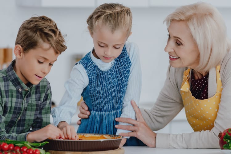 Grandma And Grandkids Making Pie Based On Thanksgiving Facts