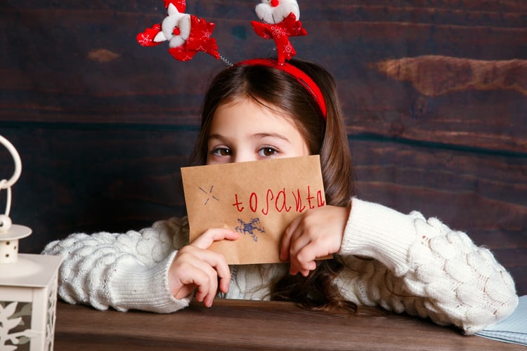 Little Girl Holding Her Letter To Santa