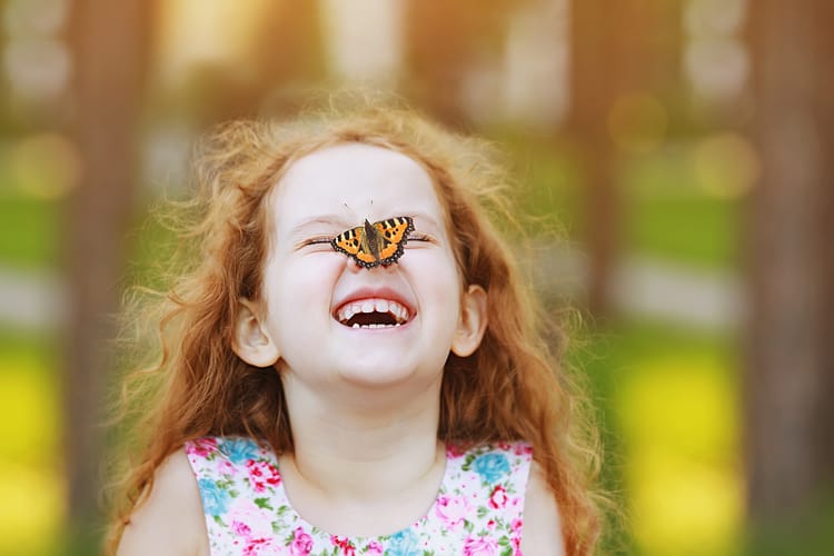 Little Girl With Butterfly On Her Nose In Miami