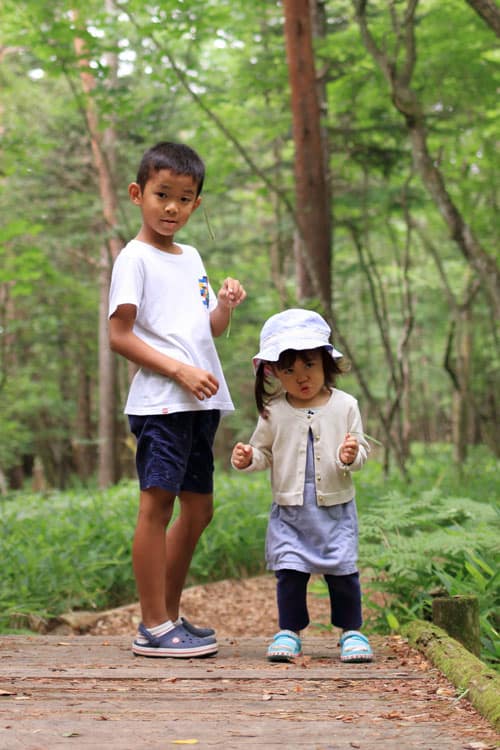 Two Children Backpacking And Hiking