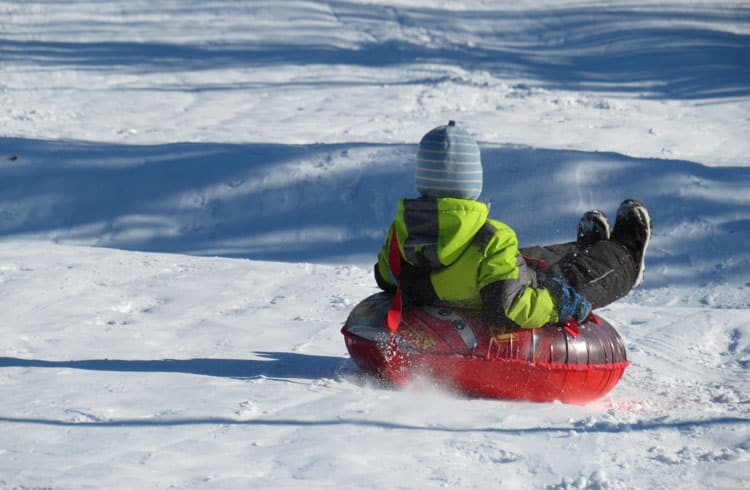 Boy Snow Tubing