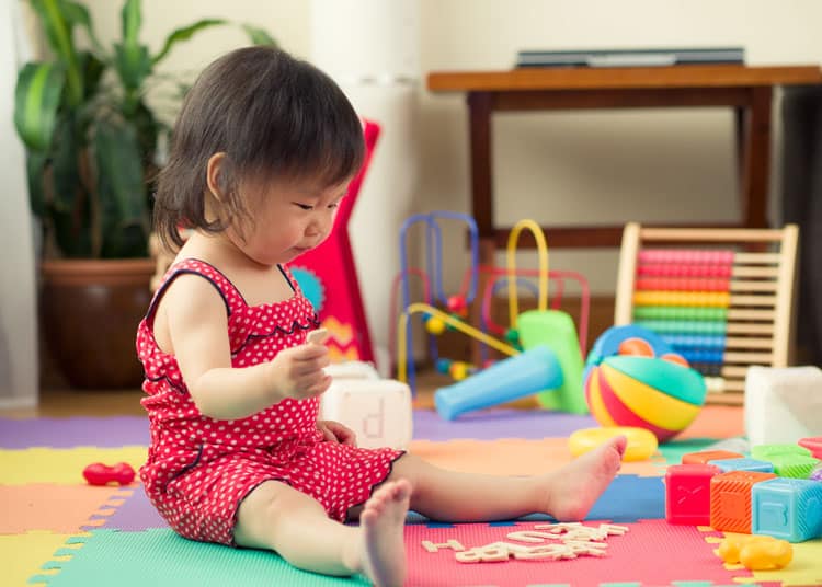 Baby Playing By Herself