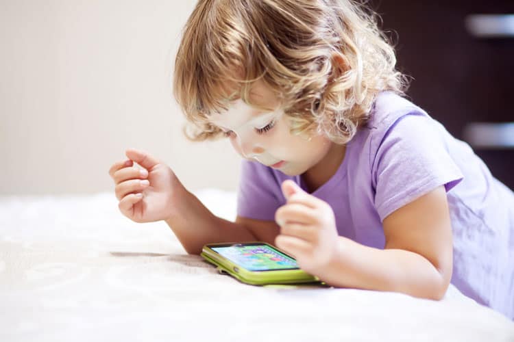 child playing on phone
