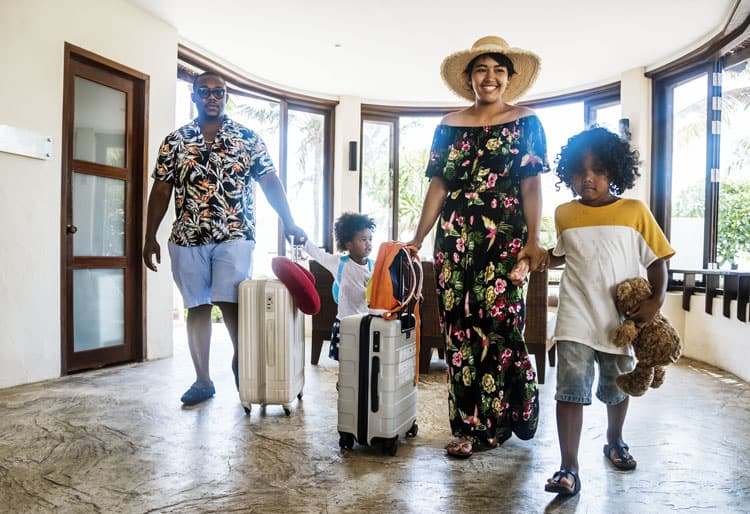 Family Checking Into A Hotel