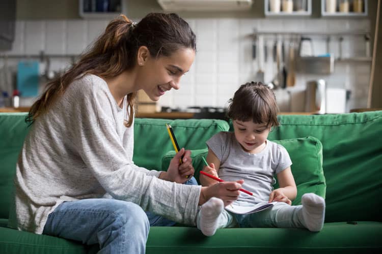 Child Writing Letter To Family Member