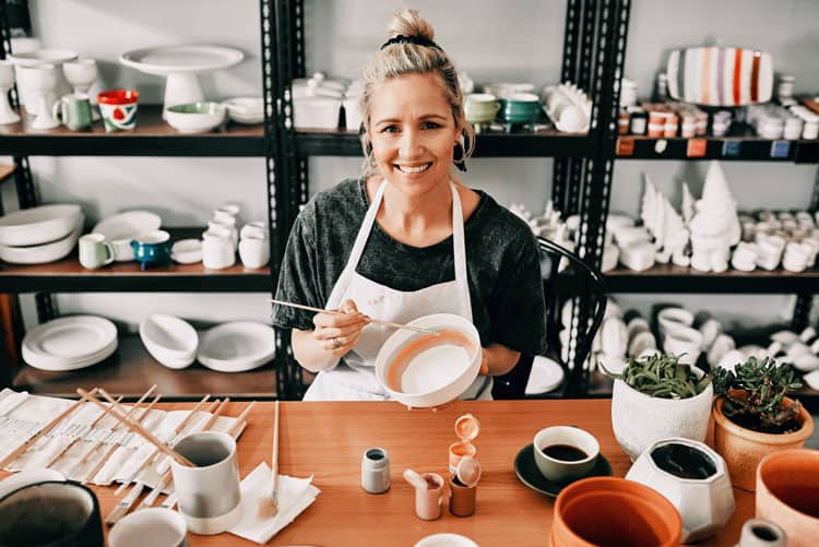 Woman Painting Pottery