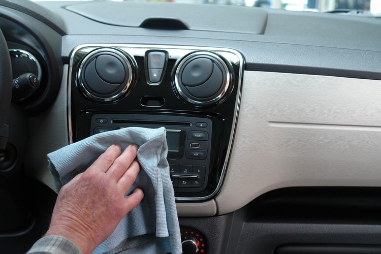 Person Cleaning The Inside Of A Car