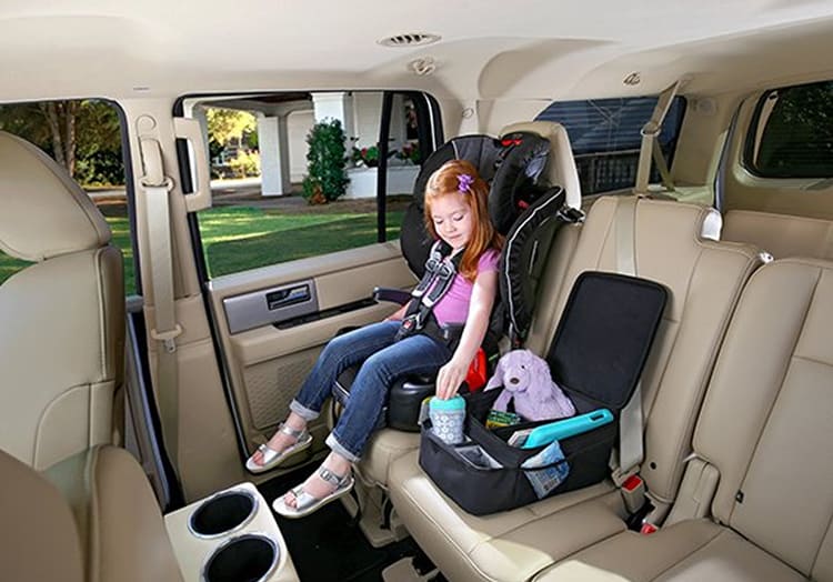 Child Sitting In A Car