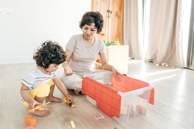 Mom Teaching Child To Clean