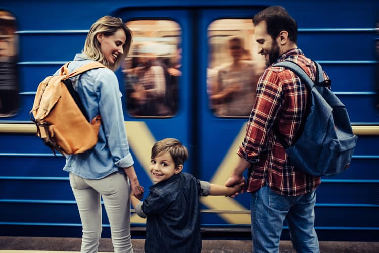 Family Standing At Subway Station