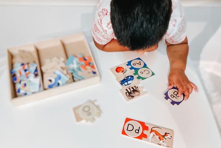 Baby Playing With Wooden Puzzle