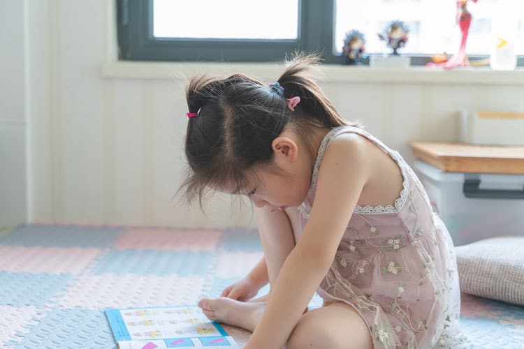 Girl Doing Schoolwork At Home