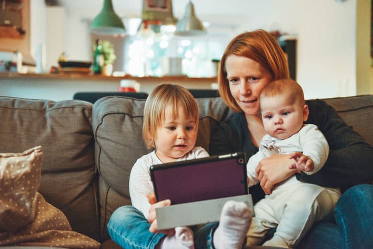 Mom And Kids Looking At Ipad