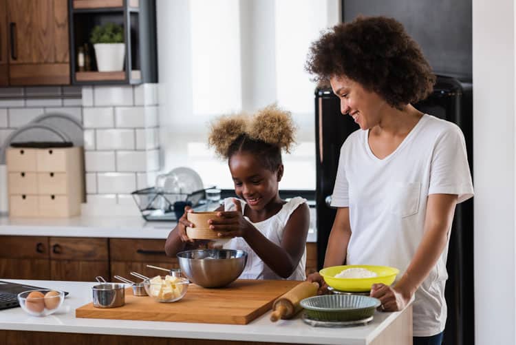 Mom And Daughter Making Cookies